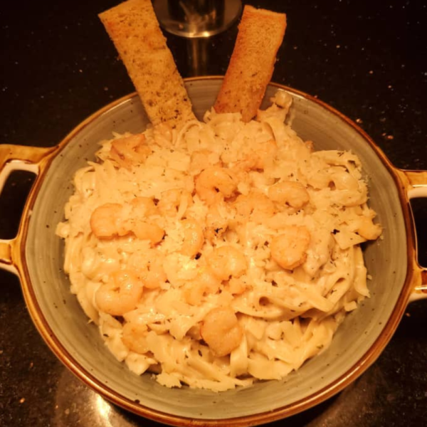 Shrimp alfredo pasta is available at our restaurant in Ikeja